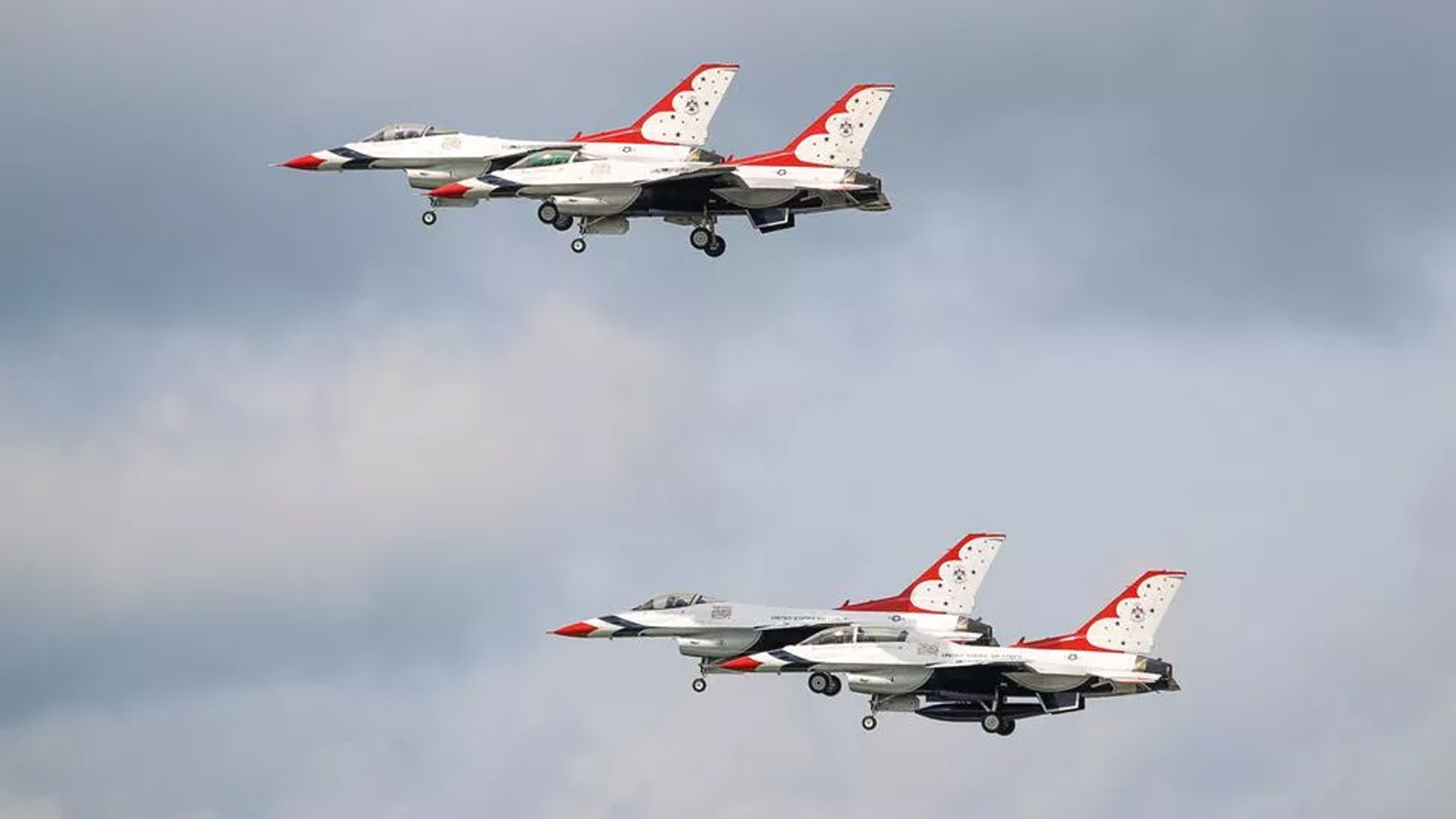 Spectacular Showdown in the Skies: Blue Angels and F-22s during Memorial Day Grace Pocono Raceway Ai...